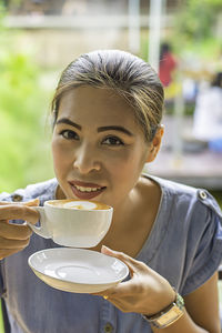 Portrait of woman with coffee