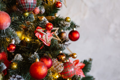 Christmas tree and red and yellow toys background.