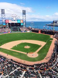 High angle view of stadium against blue sky during sunny day