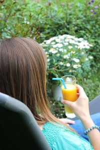 Portrait of woman drinking drink