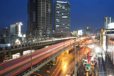 High angle view of light trails on road at night