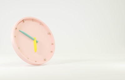 Close-up of clock against white background