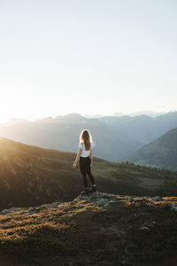 Full length of man on mountain against clear sky