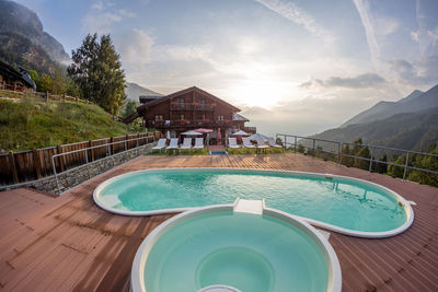 View of swimming pool against cloudy sky