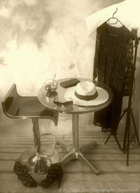 Table and chairs on floor against wall at home