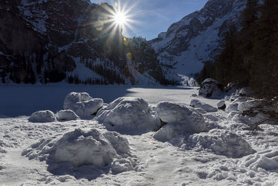 Scenic view of snow covered mountains against sky