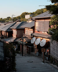 Houses in city against sky