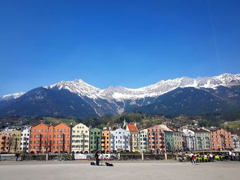 Scenic view of snow mountains against clear blue sky