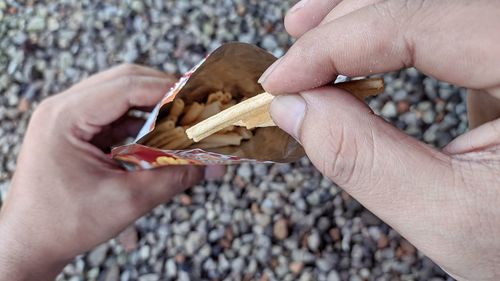 Close-up of hand holding ice cream