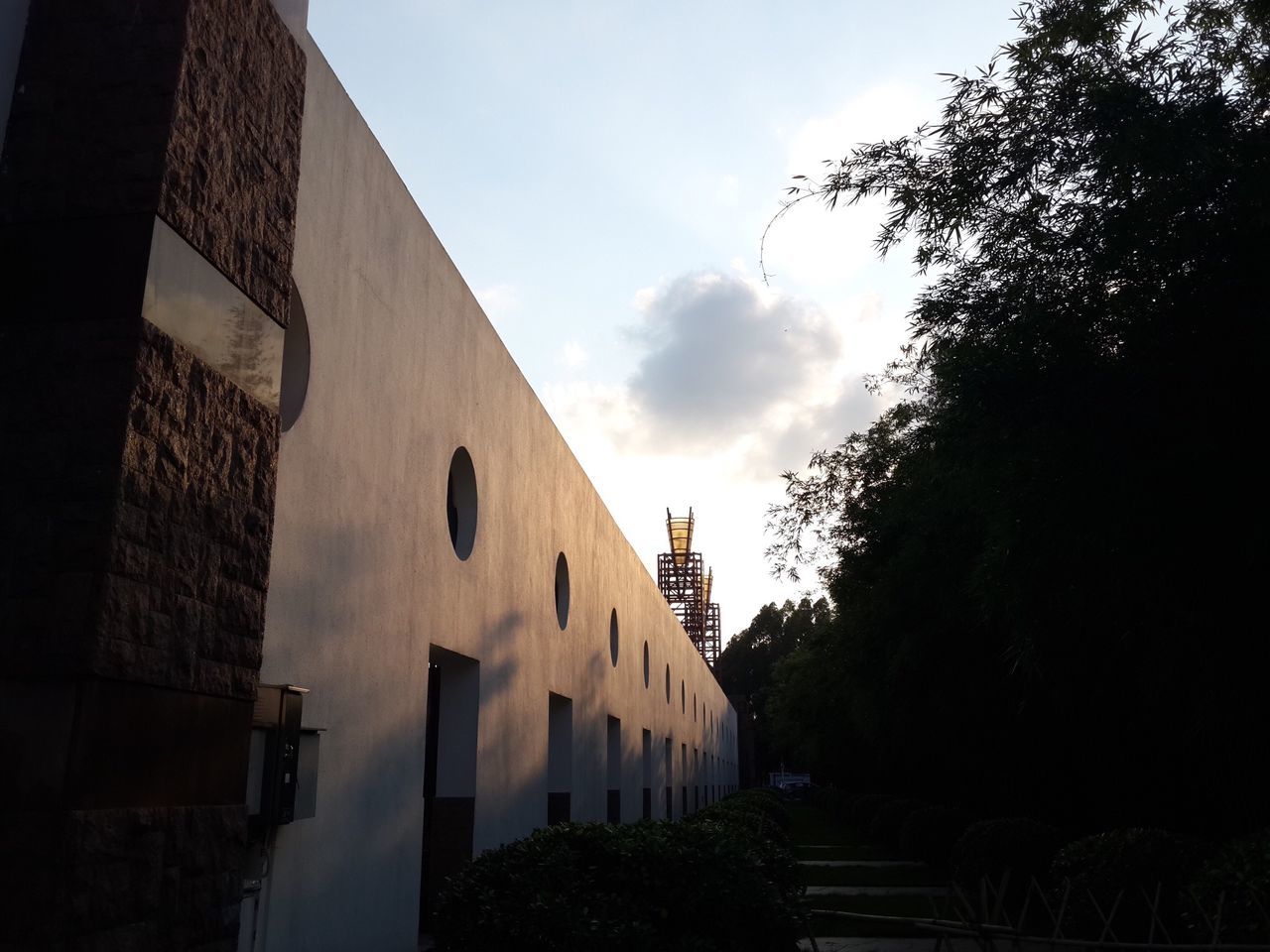 architecture, built structure, building exterior, sky, low angle view, tree, cloud - sky, building, residential building, cloud, city, silhouette, outdoors, residential structure, dusk, no people, cloudy, day, house, old