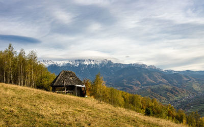 Built structure on landscape against sky