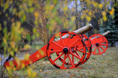 View of red cart on field