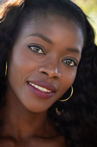 Close-up portrait of a smiling young woman