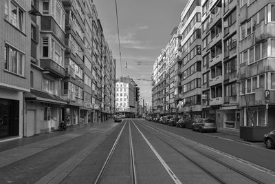 Street amidst buildings in city against sky