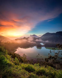 Scenic view of lake against sky during sunset