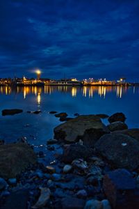 Scenic view of sea against sky at night