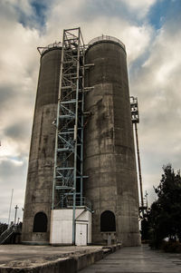 Low angle view of factory against sky