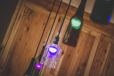 Low angle view of illuminated light bulb at home