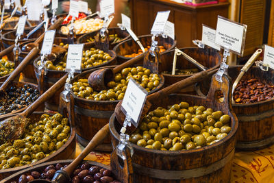 Artisan olive stall with wooden barrels at borough market in london, uk