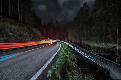 High angle view of light trails on road