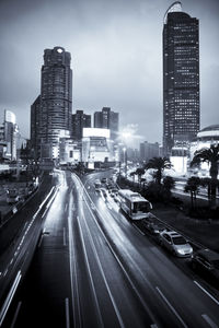 View of city street and buildings against sky
