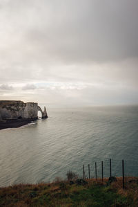Scenic view of sea against sky. scenic view of etretat and aval gate. 