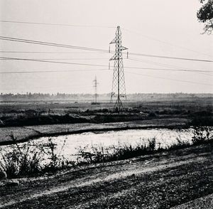 Electricity pylon on field