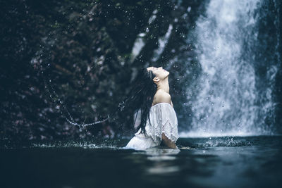 Reflection of woman in water