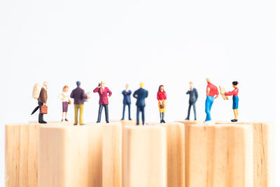 Rear view of people standing against white background