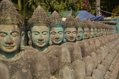 Religious sculpture in row at temple