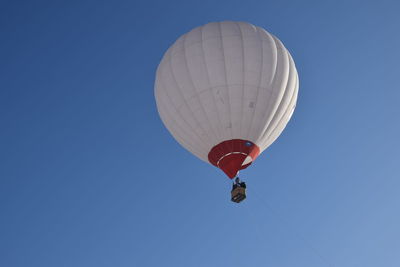 Low angle view of hot air balloon against clear sky