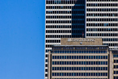 Low angle view of building against clear blue sky