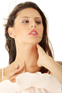 Portrait of a beautiful young woman over white background
