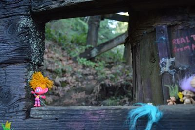 Close-up of toy on tree trunk