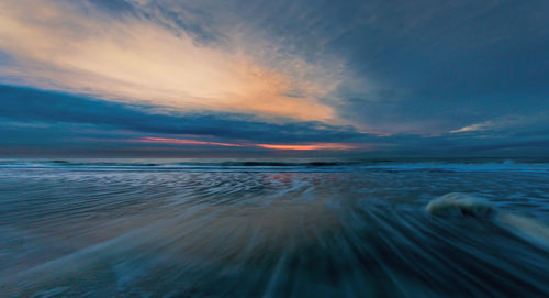 Scenic view of sea at sunset