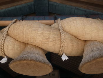 Close-up of ropes tied on wood