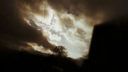 Low angle view of storm clouds at night