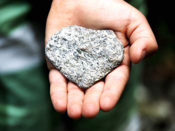 Close-up of hand holding rock