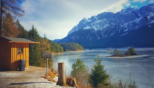 Scenic view of lake and mountains against sky