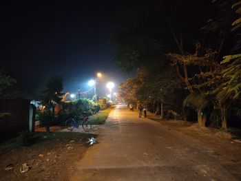 View of illuminated street at night