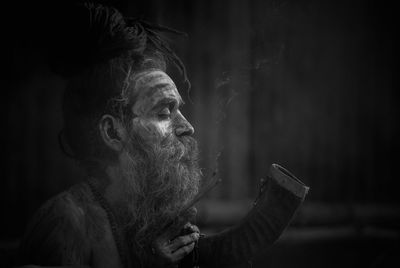 Portrait of man smoking cigarette