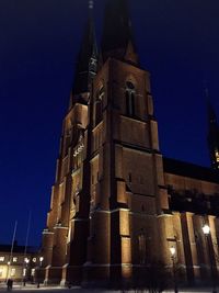 Low angle view of built structure at night