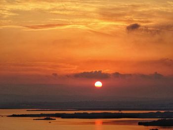 Scenic view of sea against romantic sky at sunset