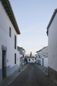 Houses in town against clear sky