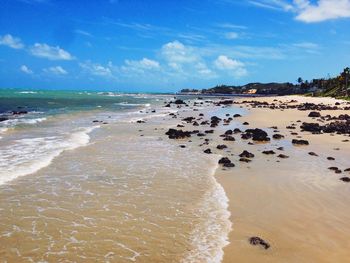 View of calm beach against sky