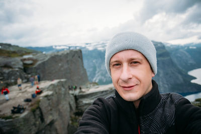 Portrait of man against sky during winter