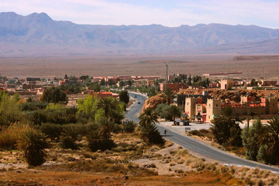 Road by buildings in town