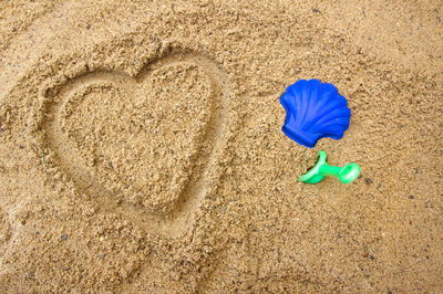 High angle view of toy on sand