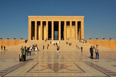 Group of people in front of historical building