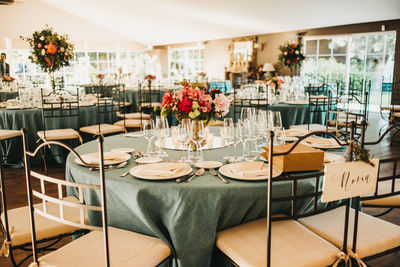 Empty chairs and tables in restaurant